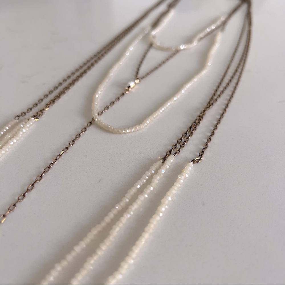 Cream crystal bead and copper  multi-length layered necklace with drop lariat